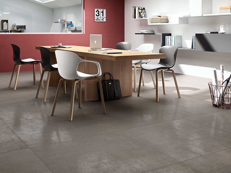 Cement-look stoneware floor for a contemporary-style office, Blustyle Concrete Jungle collection.